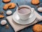 White cup with black tea and cookies on blue background. Beautiful food still life