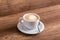 White cup of delicious aromatic freshly prepared cappuccino