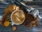 White cup of espresso on a wooden surface with yellow leaves.