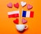 White cup and heart shapes with France and Poland flags