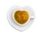 White cup in shape heart with espresso coffee on plate isolated