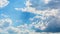 White curly clouds in a blue sky. Sky background,