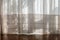 White curtain with morning light. Transparent curtain on window. Curtain background