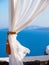 White curtain on terrace on the island Santorini. Amazing luxury resort