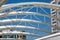 White Curved Tubular Steel Architecture Under Blue Sky