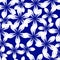 White cutout flowers on blue background