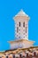 White decorative chimney on roof with blue sky