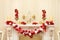 White Decorative fireplace decorated with candles and garlands o