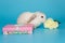 White decorative fold rabbit with a gift box and flowers