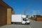 White delivery truck leave warehouse, motion blur effect