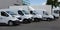 White Delivery Trucks parked in Warehouse Building