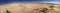 White desert mountains panorama with a road running to the horizon