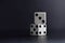 White dice pair on black background