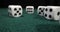 White dices on green cloth background. game cubes Dolly shot. Casino elements on green.