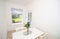 White dining room with table, flowers and window