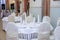 White dining tables. Wedding tables. Table setting for a wedding. White wedding table decoration