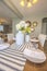 White dinnerware and table runners at the dining room of a family home