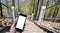 White display Smart phone in hand,Blurred Cement stairs up a mountain background.