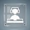 White DJ wearing headphones in front of record decks icon isolated on grey background. DJ playing music. Square glass