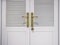 White door with gold handle decoration