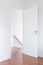 White door, wood floor to down stair in modern home, minimalist style