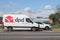 White DPD courier cargo van delivers goods. Motion blur. Riga, Latvia - 28 Jun 2021