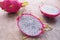 White dragon Fruit and some slice on old Wooden Table