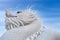 White Dragon Guard statue - exterior of Wat Huay Pla Kang, Big Buddha temple at sunset in Chiangrai, Chiang Rai province, North