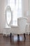 White dressing table and chair with glass miror