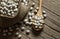 White dried haricot kidney beans and boiled beans on wooden table