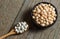 White dried haricot kidney beans and boiled beans on wooden table