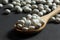White dried haricot kidney beans on wooden table