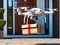 White drone delivering package to a residence