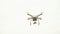 White drone, quadrocopter, with photo camera flying in the blue sky