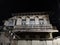 White dwelling house with balcony and closed blue shutters at night