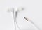 White earbuds with socket isolated on background