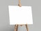 White easel stands next to grey wall, 3d rendering