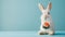 White Easter bunny with sushi on blue background, copy space