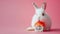 White Easter bunny with sushi on pink background, copy space