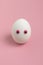 White Easter egg with decorative eyes.