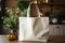 White eco friendly shopping bag mock up. Linen tote shopper bag on kitchen table