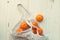 White eco-friendly string bag with fruits, oranges  on wooden background, plastic free shopping