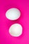 White egg and  eggshell on the pink background. Copy space. Minimalism, original and creative photo. Beautiful wallpaper. Easter