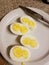 white eggs with double yolks on a plate with a knife