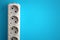 White electrical multi plug extender with european socket on bright blue background