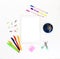 White electronic tablet and stationery, pens, paper clips, pencils and writing paper