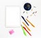 White electronic tablet and stationery, pens, paper clips, pencils and writing paper