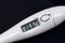 White electronic thermometer close up, temperature is normal