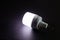 white emergency led bulb with integrated battery on dark