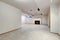 White empty basement room with fireplace